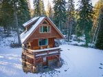 Surrounded by woods, Beaver Lake Luxury Cabin is a peaceful Montana retreat. 